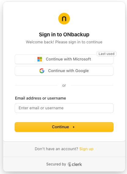 The ONbackup sign-in screen, powered by Clerk, with Google and Microsoft single sign-on options.